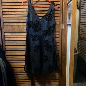 Brand new, Tag still on, never been worn. Navy blue with black velvet flowers